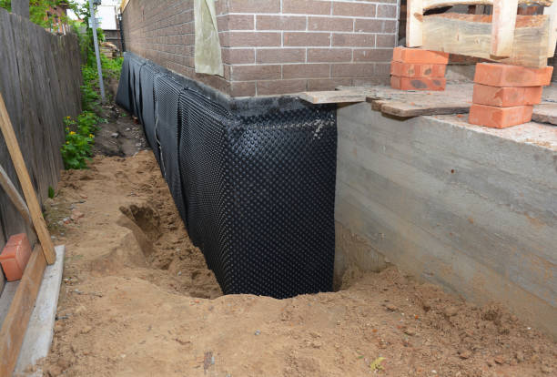 Happy homeowners after waterproofing job in North Liberty